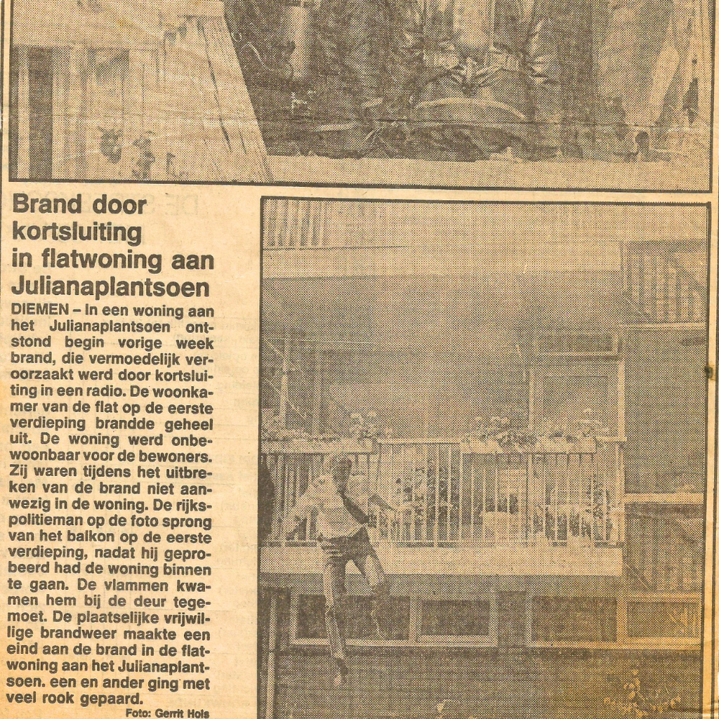 Newspaper image showing a man on a balcony of a multi-story building as smoke or fire incident is reported in Dutch news.